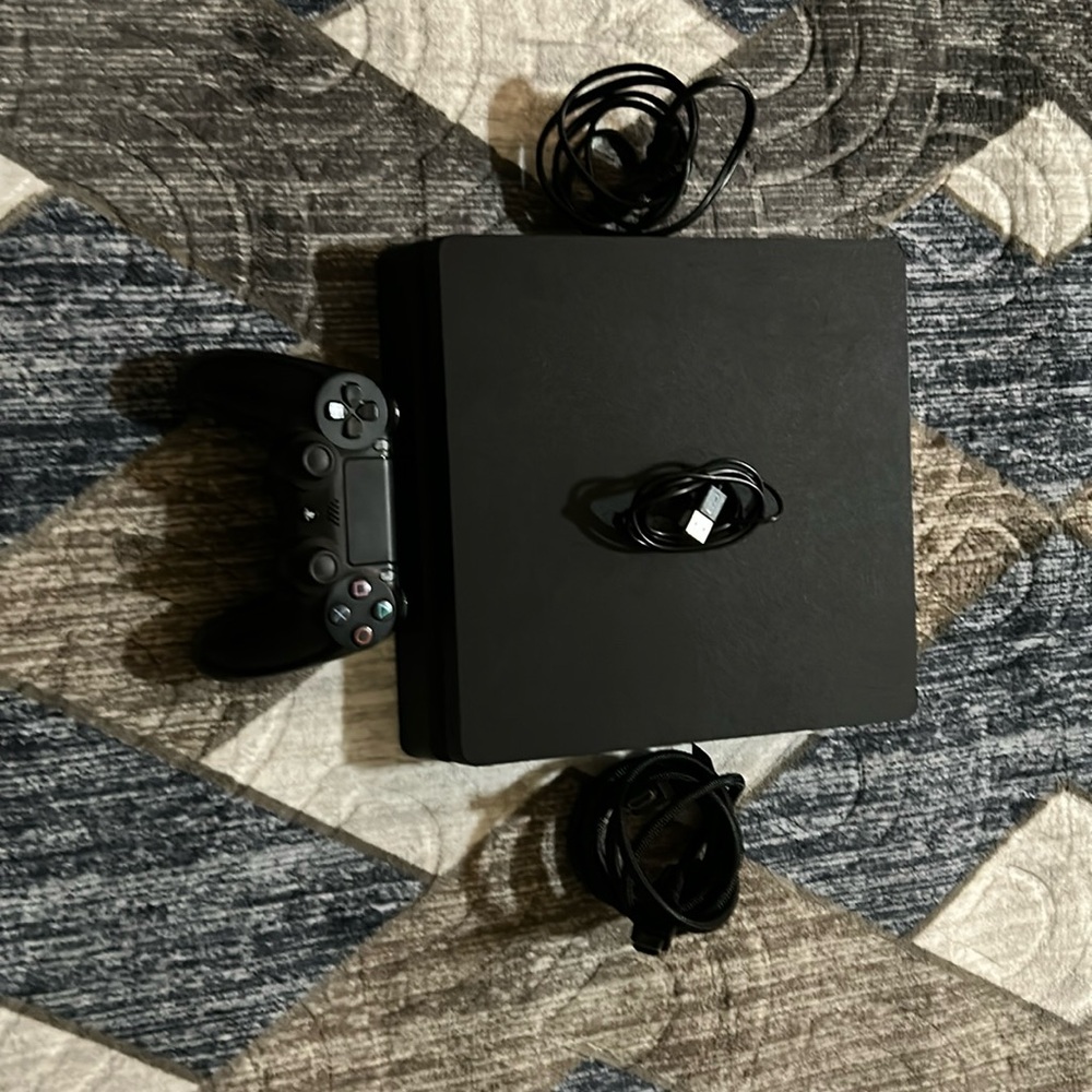 PS4 with the controller and HDMI cable and power cord